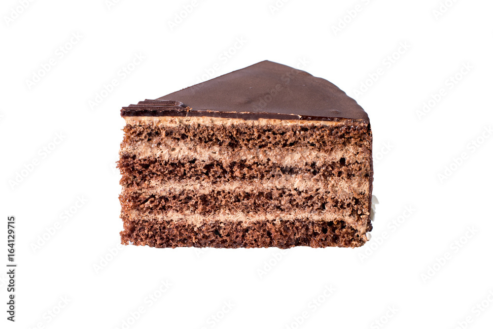Isolated piece of chocolate layered cake with nougat and biscuit in the cut Isolated piece of chocolate layered cake with nougat and biscuit in the cut