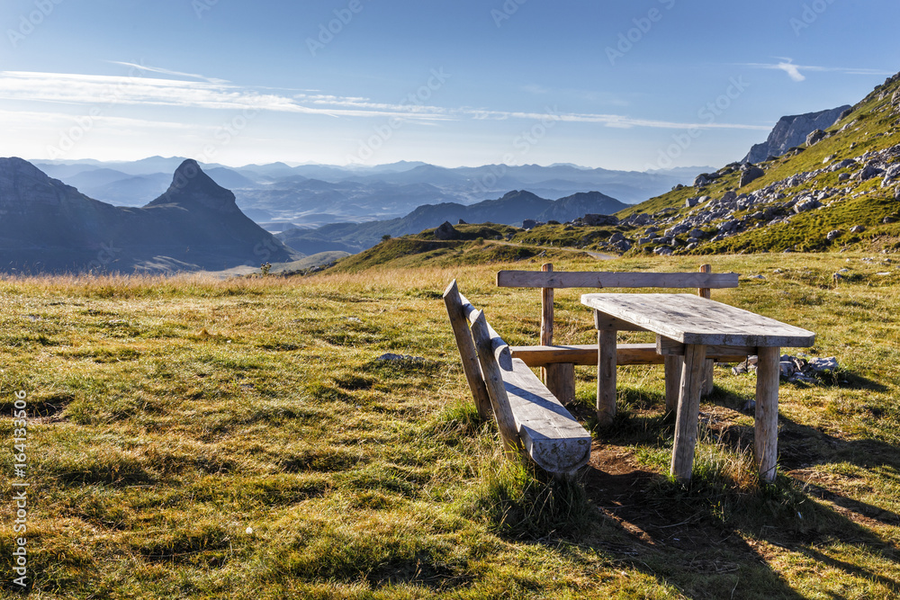 Empty wooden bench on Sedlo Pass in Durmitor in Montenegro