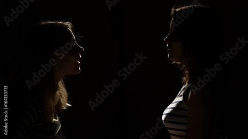 Two girls angry with each other. Anger, quarrel, violence. Unhappy mother and daughter or two sisters, family issues.