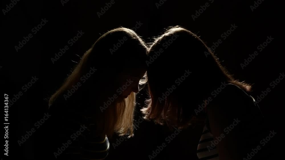 Two girls angry with each other. Anger, quarrel, violence. Unhappy mother and daughter or two sisters, family issues. Two girls angry with each other. Anger, quarrel, violence. Unhappy mother and daughter or two sisters, family issues.