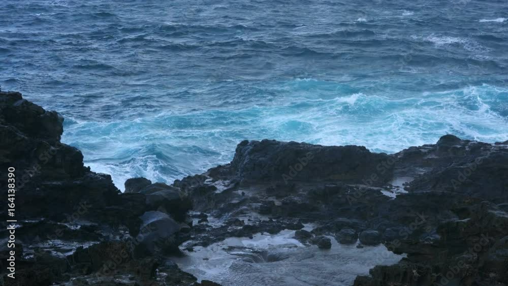 Nakalele blowhole on north coast of Maui by rough ocean Nakalele blowhole on north coast of Maui by rough ocean