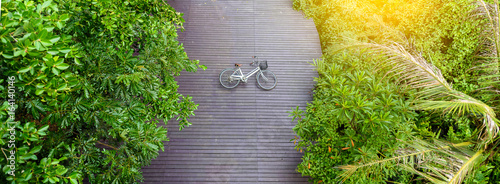 Vintage bicycle on wooden floor at Sri Nakhon Khuean Khan Park and Botanical Garden