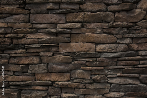 pattern gray color of modern style design decorative uneven cracked real stone wall surface