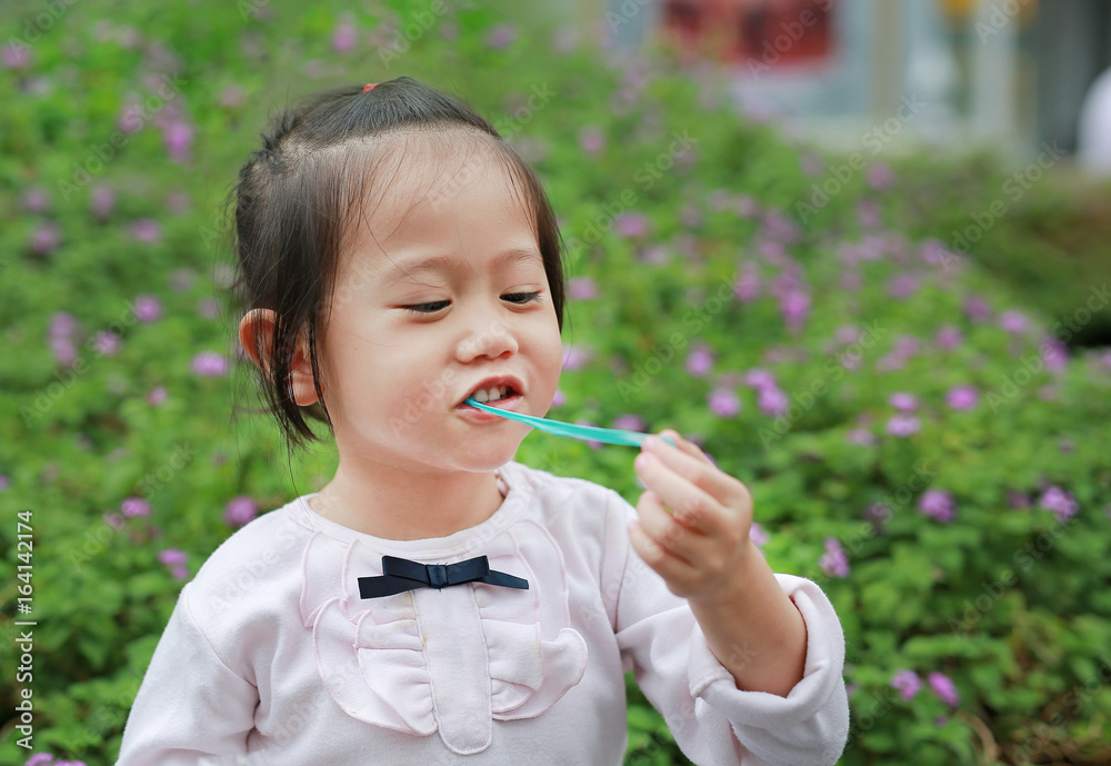 Cute little girl enjoy eating bubble gum. Cute little girl enjoy eating bubble gum.