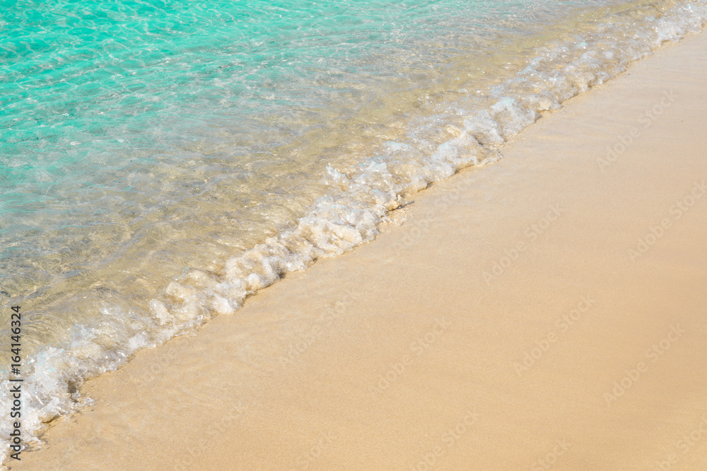 Beautiful light blue seashore with sea foam, italian beach, natural marine background