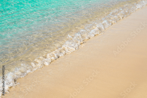 Beautiful light blue seashore with sea foam  italian beach  natural marine background