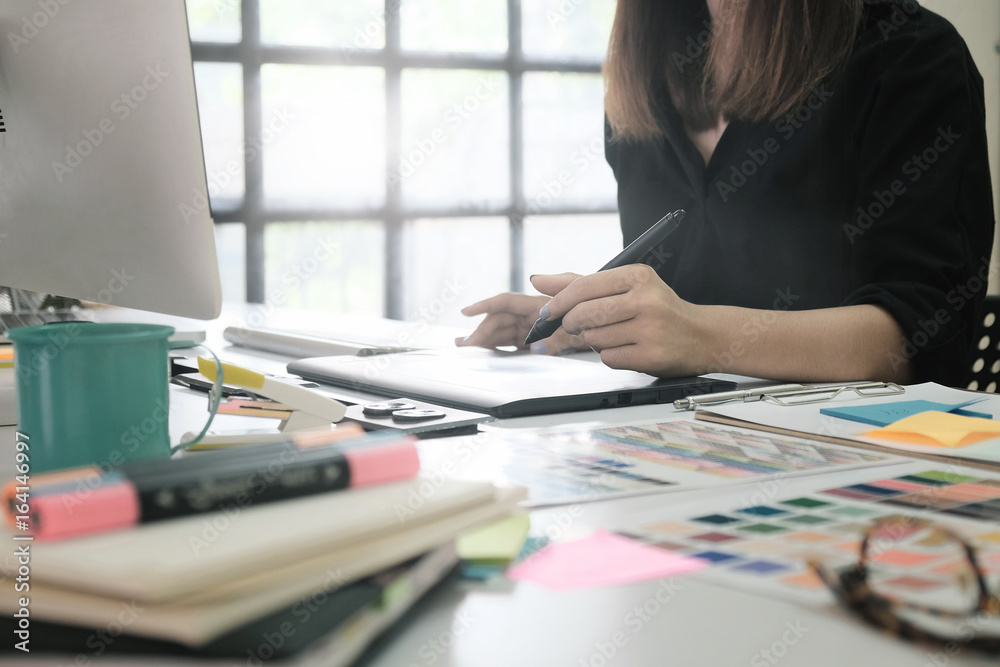 Graphic designer woman working on creative office with create graphic on computer. Graphic designer woman working on creative office with create graphic on computer.