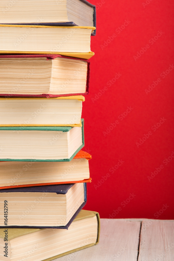 education and wisdom concept - open book on wooden table, color background education and wisdom concept - open book on wooden table, color background