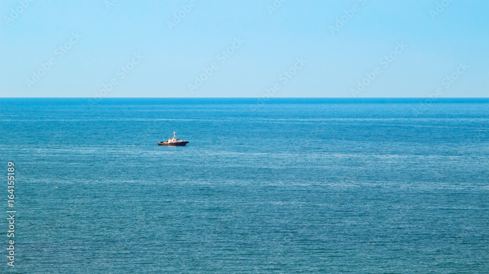 View for the sea with sea boat in azure water at the sunny summer day