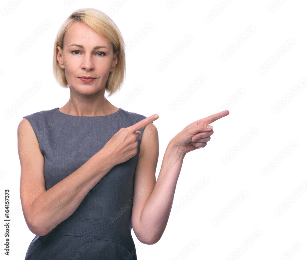 Beautiful mid aged woman pointing finger in side. Beautiful mid aged woman pointing finger in side.