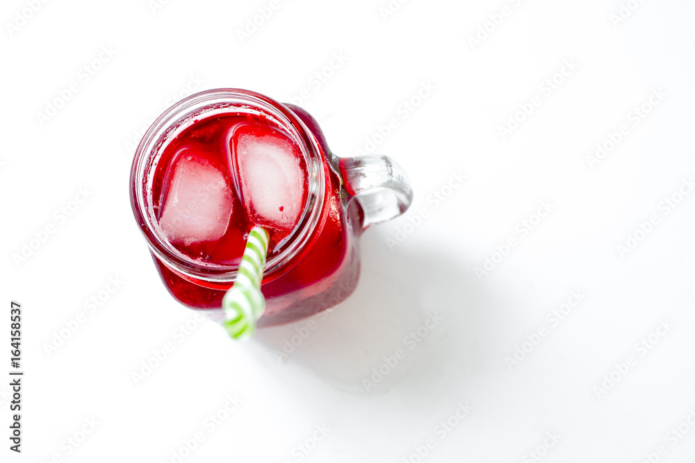 Summer iced drink - tea or juice with ice and berries Summer iced drink - tea or juice with ice and berries