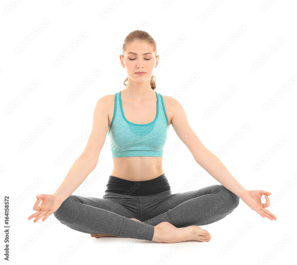 Young beautiful woman practicing yoga pose on white background