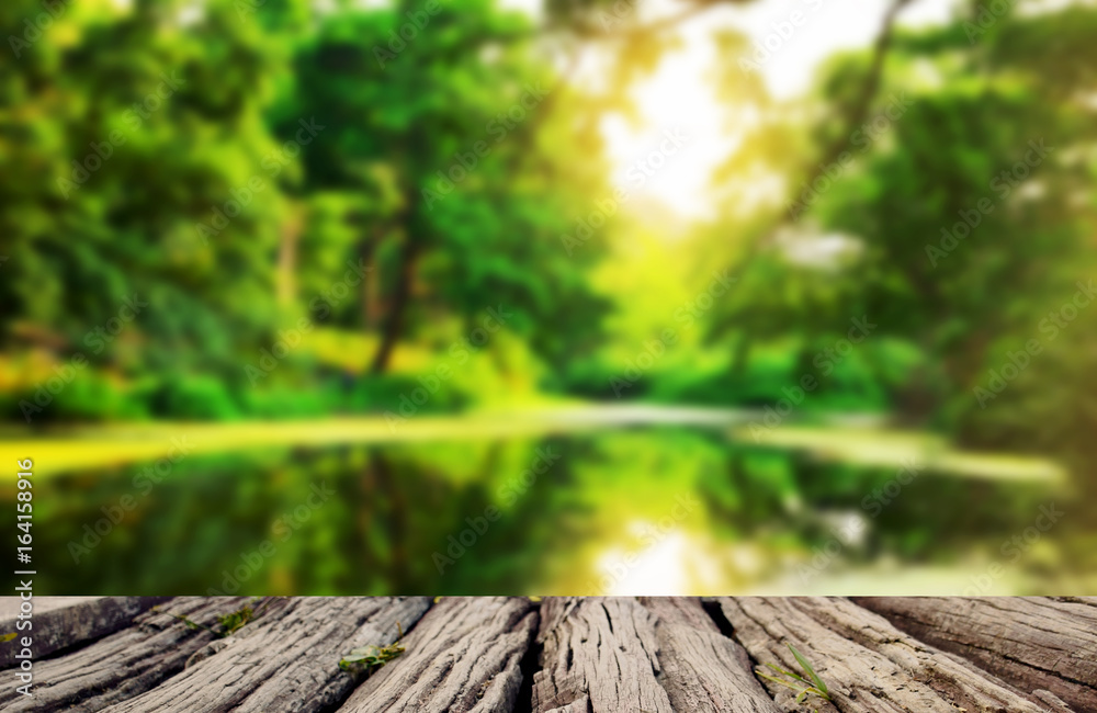 Empty top wooden table on lake in beautiful green nature rural at landscape Empty top wooden table on lake in beautiful green nature rural at landscape