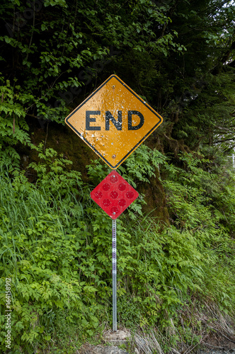 End of the road with bulletholes photo