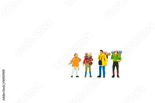 Miniature people  group of traveler isolated on white background using as exploring on earth concept