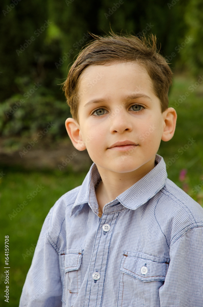 Head And Shoulders Portrait Of Boy Outside A House. Fashion photography. Head And Shoulders Portrait Of Boy Outside A House. Fashion photography.