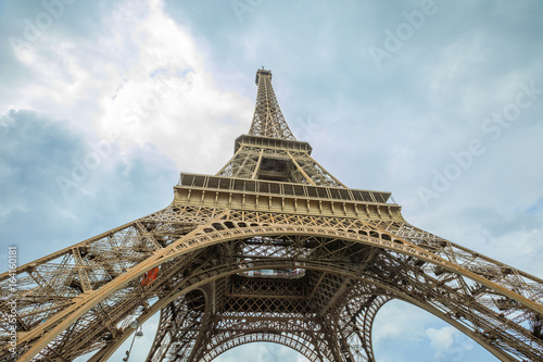 Prospective view of Tour Eiffel, symbol and icon of Paris. Bottom view of Eiffel Tower in the sky, Paris, France, Europe.