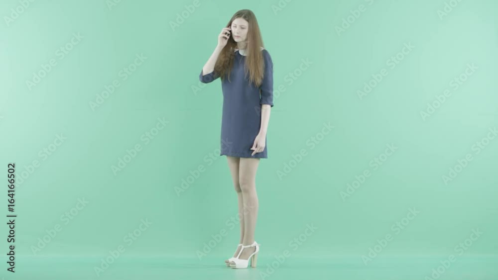an angry young girl talks on the phone an angry young girl talks on the phone