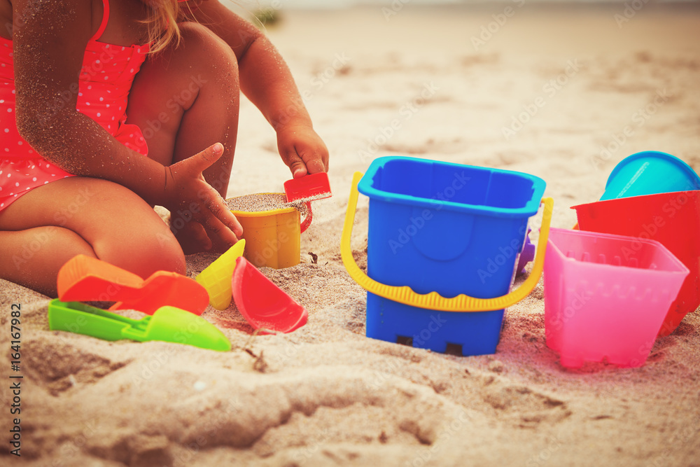 hands of little girl play with sand on beach hands of little girl play with sand on beach