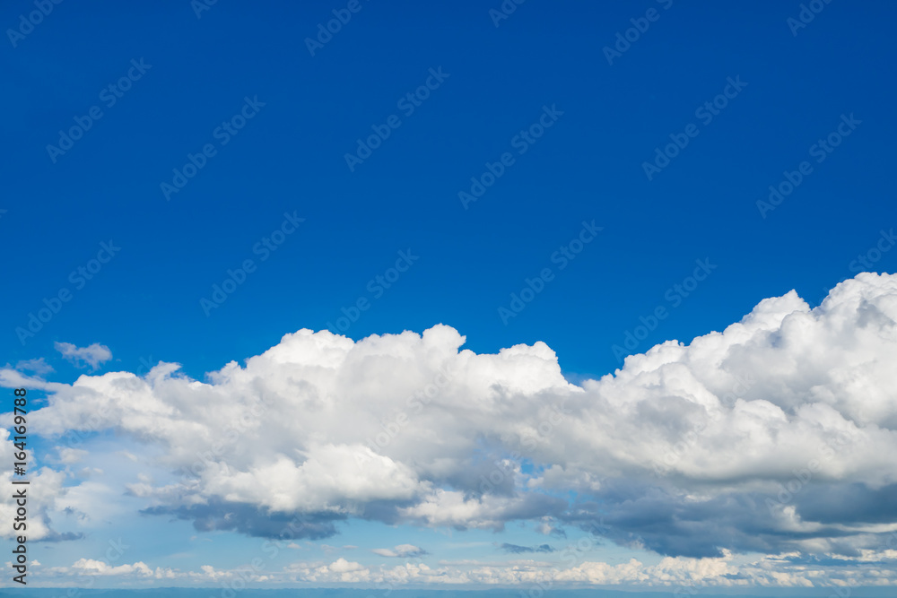 The blue sky with clouds, background.
