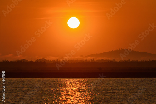 Big sun and Mist in sunrise Sun on Sunrise sun and mist on mountian White balace orange on sunrise