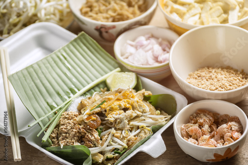 Pad-Thai Food of Thailand for Take home Arrange on a wooden table. © poomsak