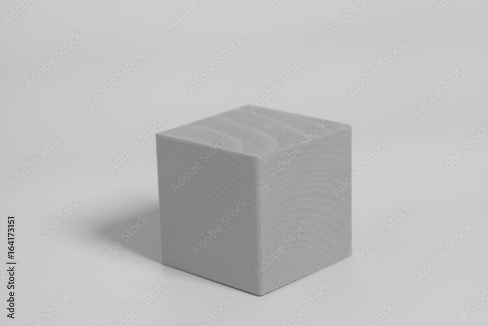 Wooden cube on gray background Wooden cube on gray background
