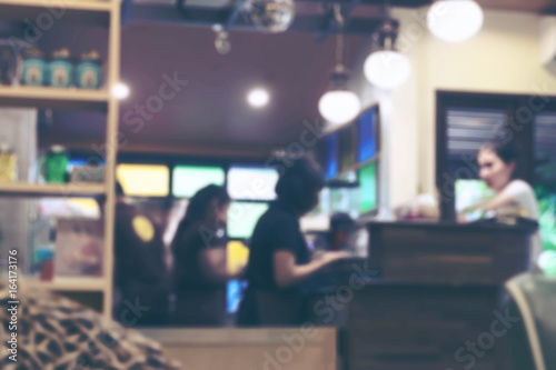 Barista busy at work at coffee shop, Soft focus
