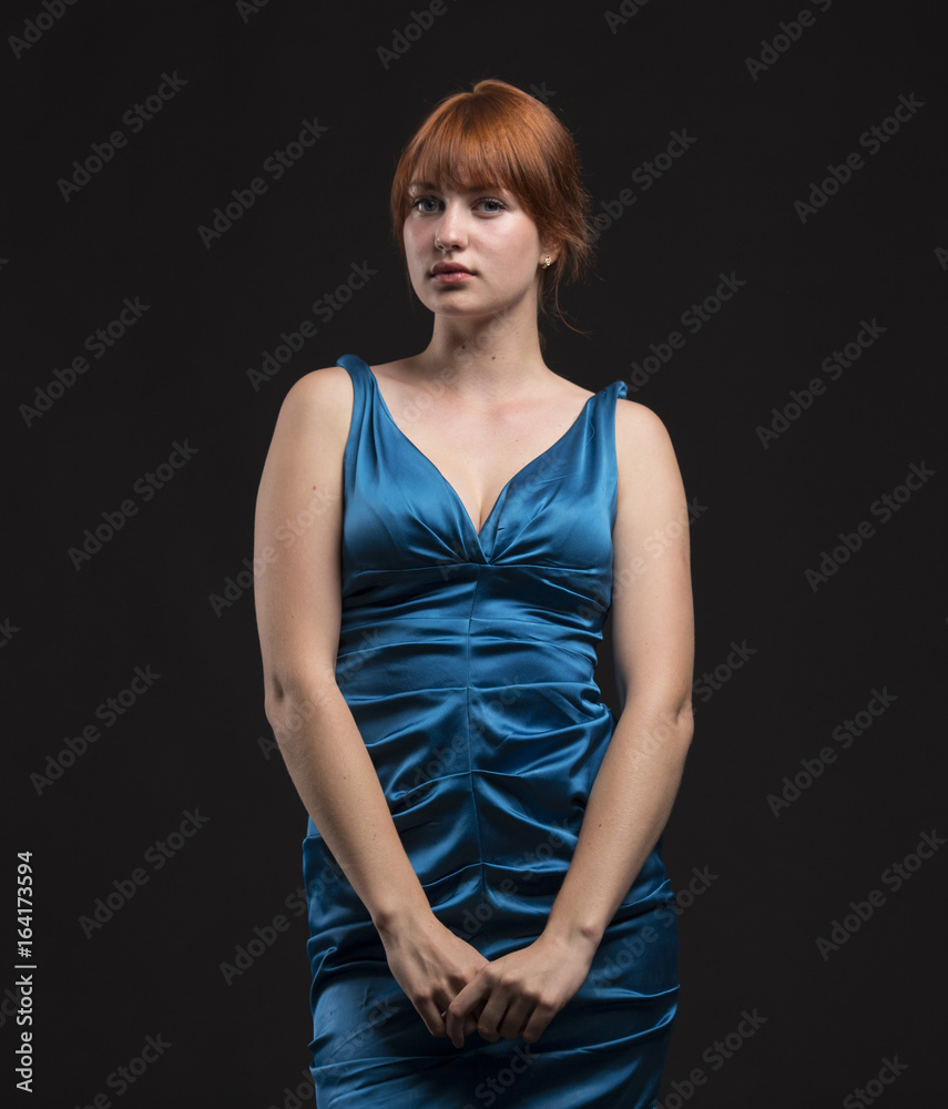 Young pensive woman portrait of a confident businesswoman on a black background. Ideal for banners, registration forms, presentation, landings, presenting concept.