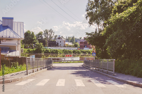 old town street road and a river in summer vologda, russia