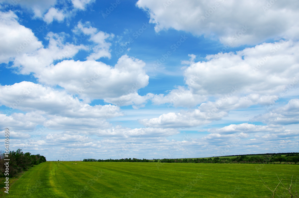 green field on a background clouds green field on a background clouds