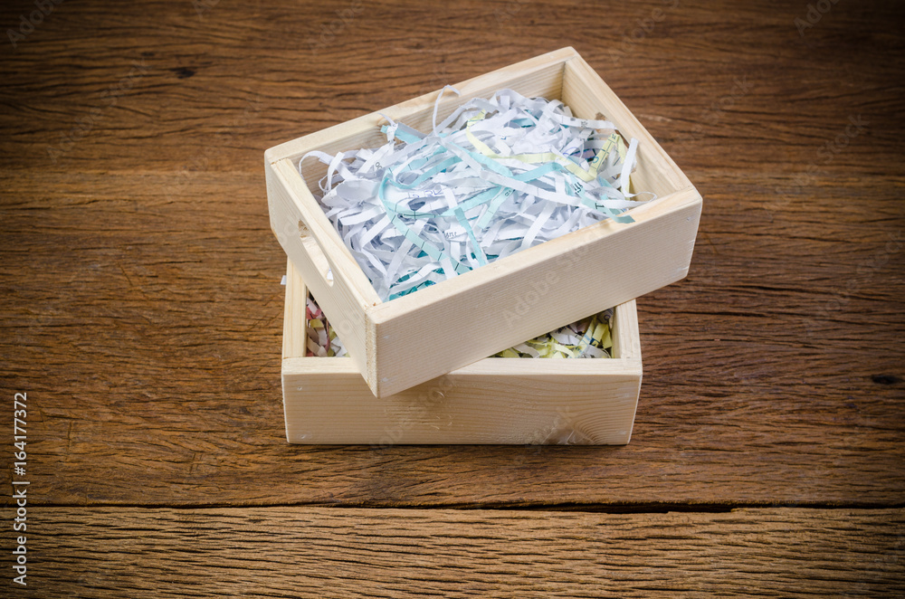 Fototapeta premium shredded paper in wooden box