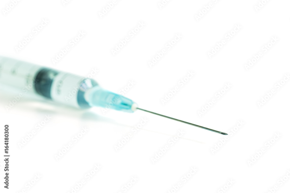 The syringe and needle isolated on white background The syringe and needle isolated on white background