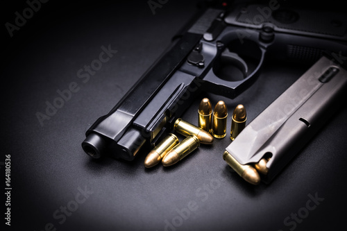  9mm pistol gun on black background photo