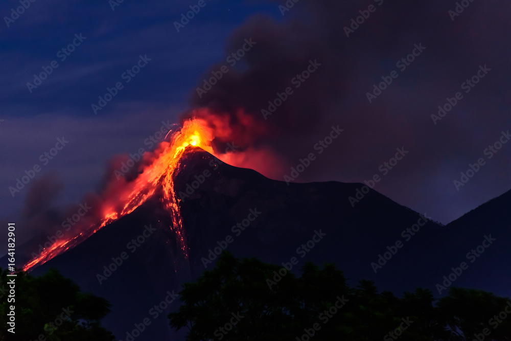 Lava spurts from erupting Fuego volcano in Guatemala