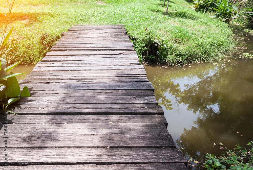 Small wooden bridge with the sunlight.