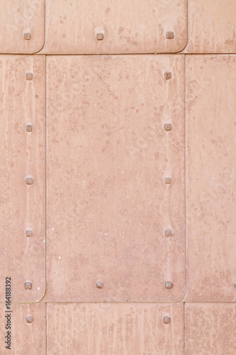 rusty metal brown old door with rivets background