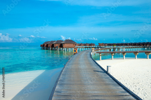 beach with water bungalows at Maldives