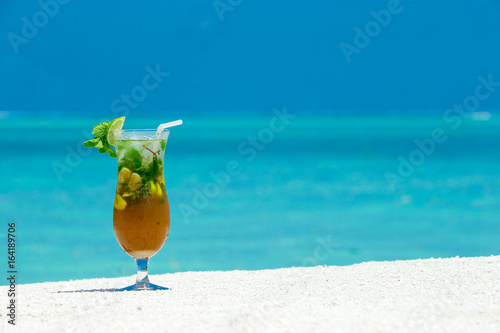 cocktail with blur beach on background
