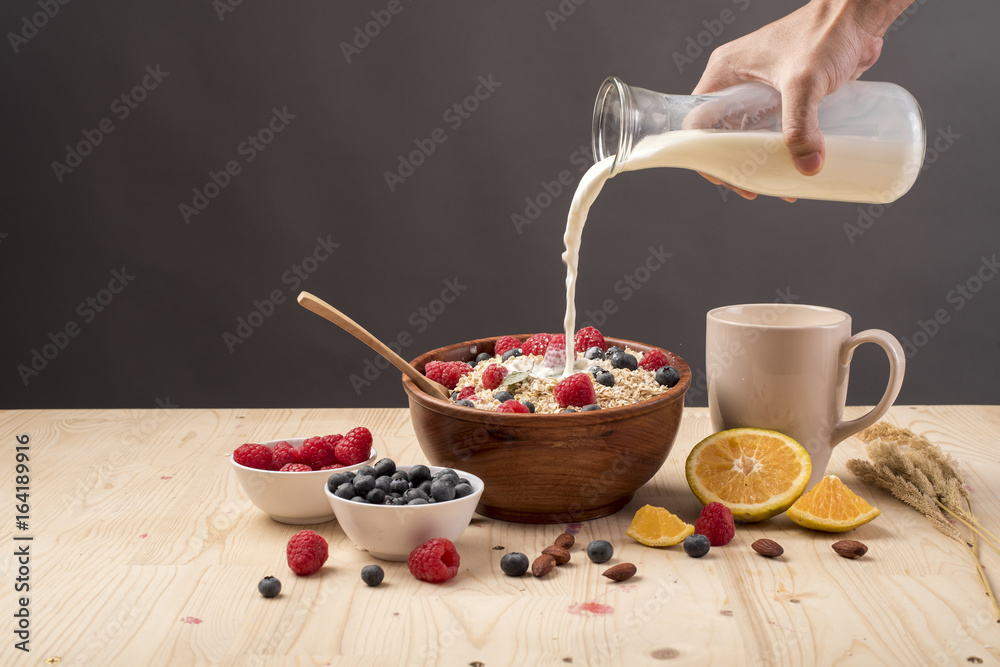 Fototapeta premium Healthy breakfast ingredients on wood table, Healthy food concept
