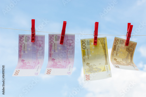 Euro banknote on a rope weigh and dried. photo