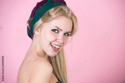 woman with turban and makeup on pink, pinup
