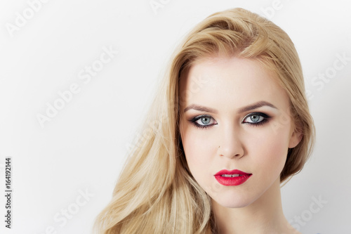 Girl with red lips on pretty face