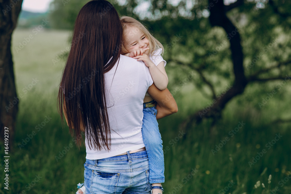 Fototapeta premium child near tree with mom