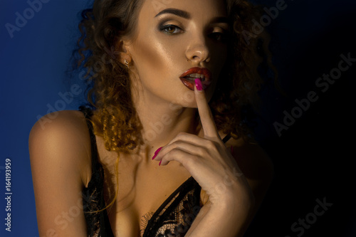 close up portrait of gorgeous lady with curly hair and beautiful make up