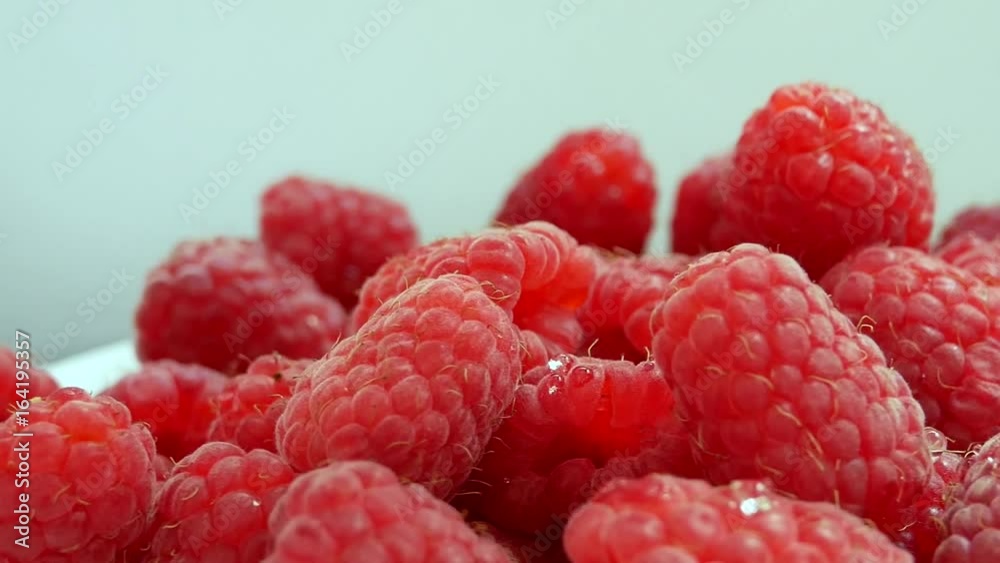 Group of Ripe Juicy Red Raspberries Rotates on the White Background. Raspberry falls Group of Ripe Juicy Red Raspberries Rotates on the White Background. Raspberry falls