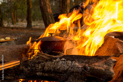 Cast-iron pot on burning fire