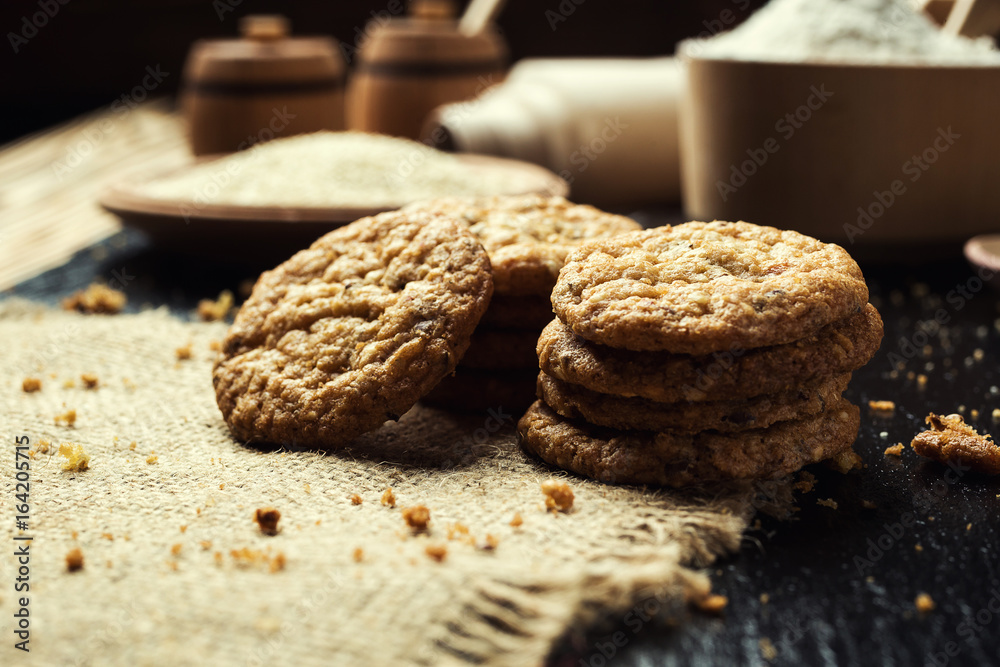 Biscuit sweet cookie background. Domestic stacked butter biscuit pattern concept,close up macro.Homemade cookies on wooden table.Cereal biscuits with the sesame,peanuts,sunflower and amaranth. Biscuit sweet cookie background. Domestic stacked butter biscuit pattern concept,close up macro.Homemade cookies on wooden table.Cereal biscuits with the sesame,peanuts,sunflower and amaranth.