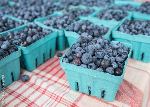 Pints of blueberries for sale at a farmers' market