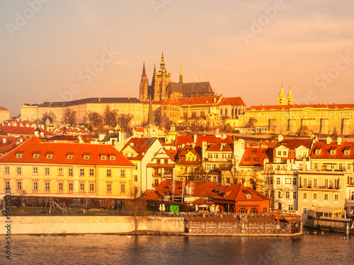 Prague Castle and Vltava River illuminated by golden sunrise, Prague, Czech Republic.